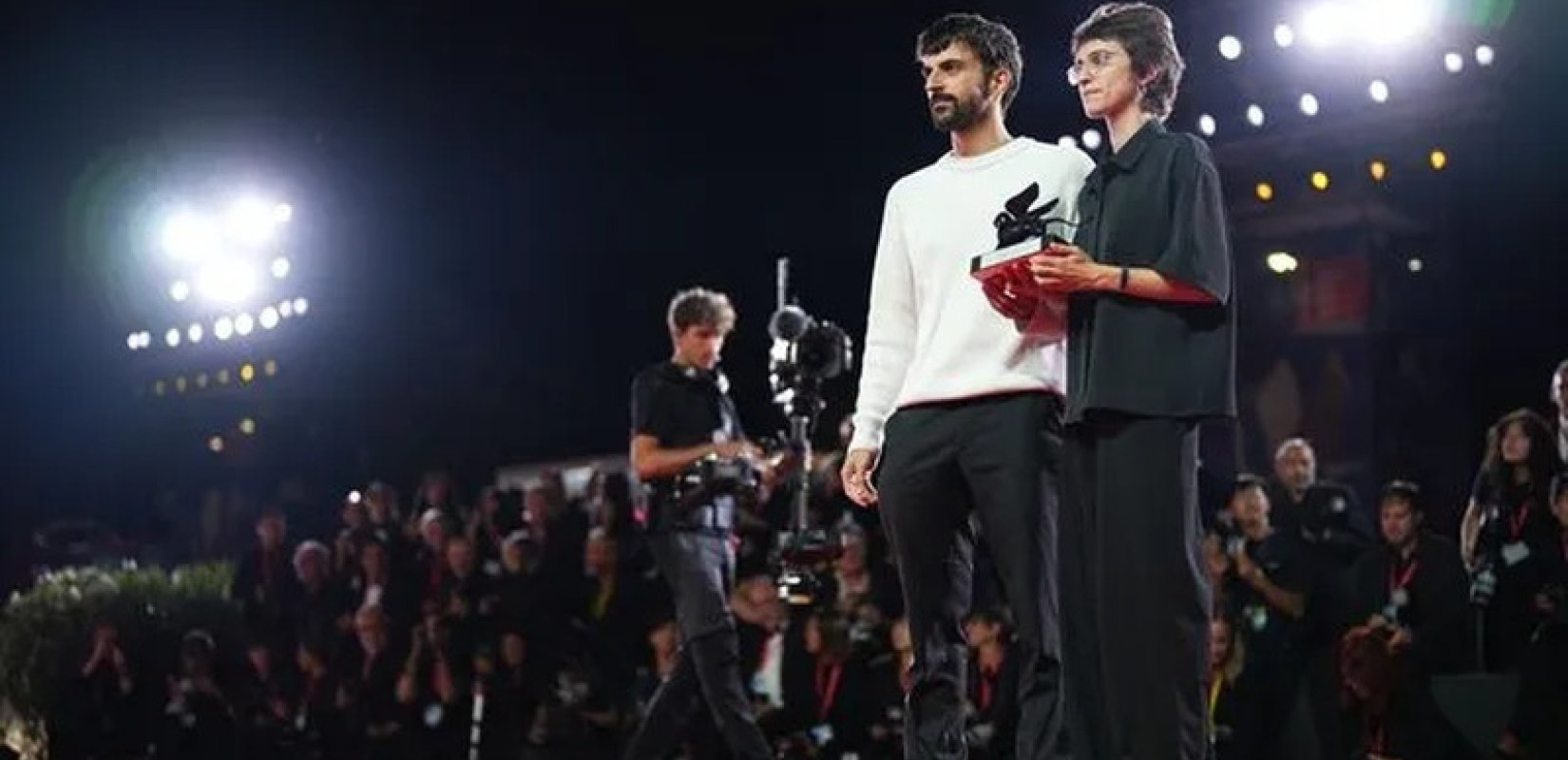 Directors Rachel Szor, left, and Yuval Abraham, winners of the special jury prize for the film 'Naza', pose for photographers at the awards photo call during the closing ceremony of the 83rd edition of the Venice Film Festival in Venice, Italy, on Saturda